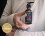 Pregnant woman holding belly bump elixir